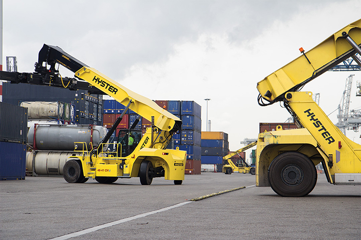 a yellow forklifts and a container truck