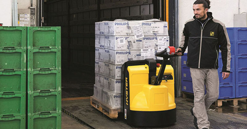 a man holding a yellow and black machine